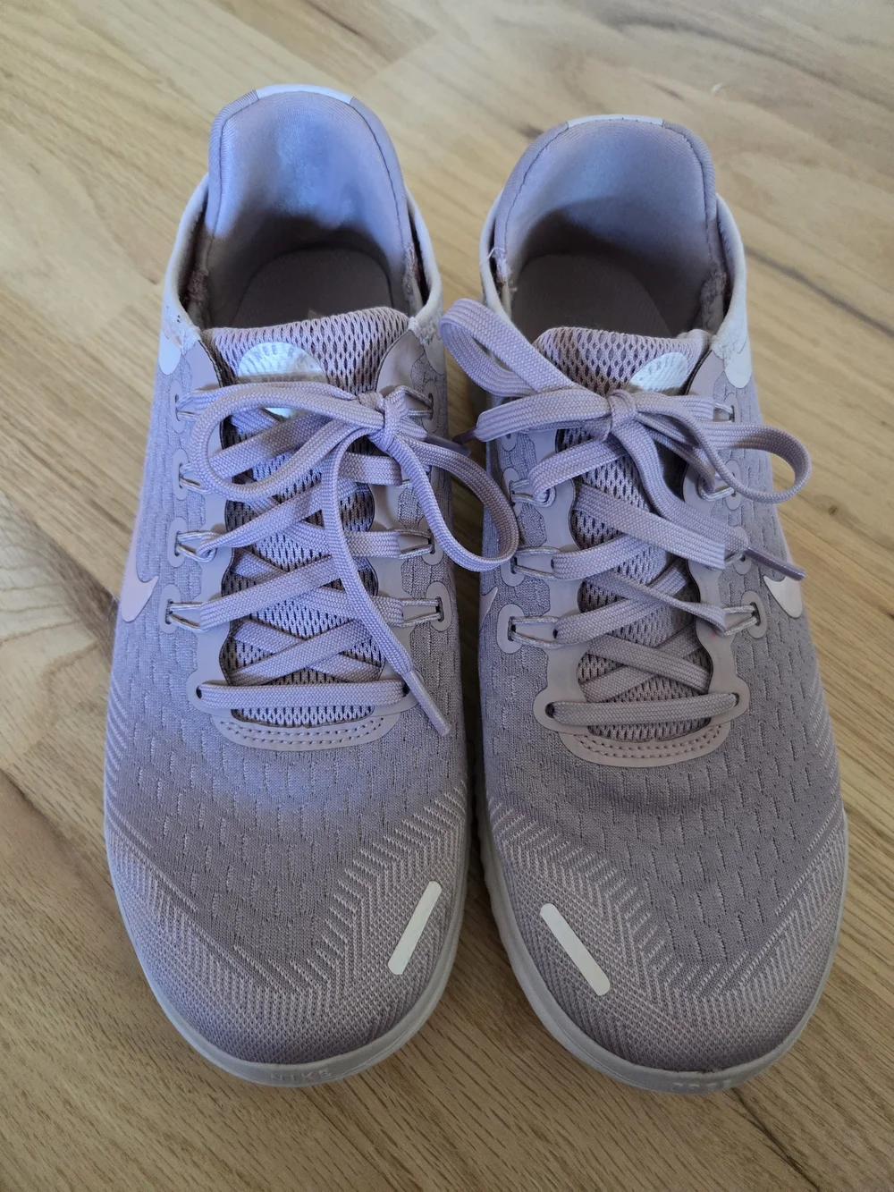 Nike Women's Pink Lilac Athletic Running Sneakers with White Swoosh